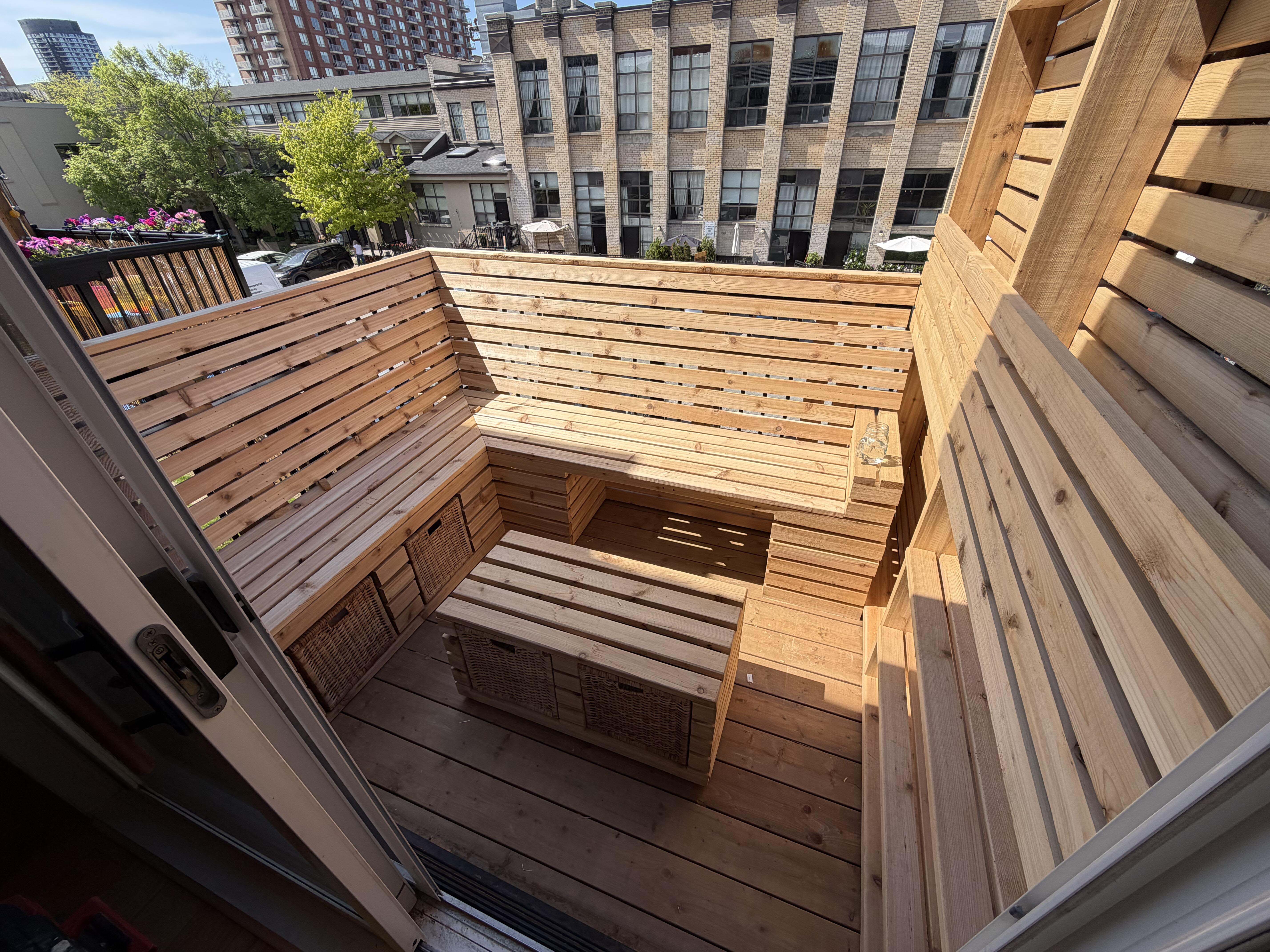 Custom cedar balcony seating, privacy wall and storage