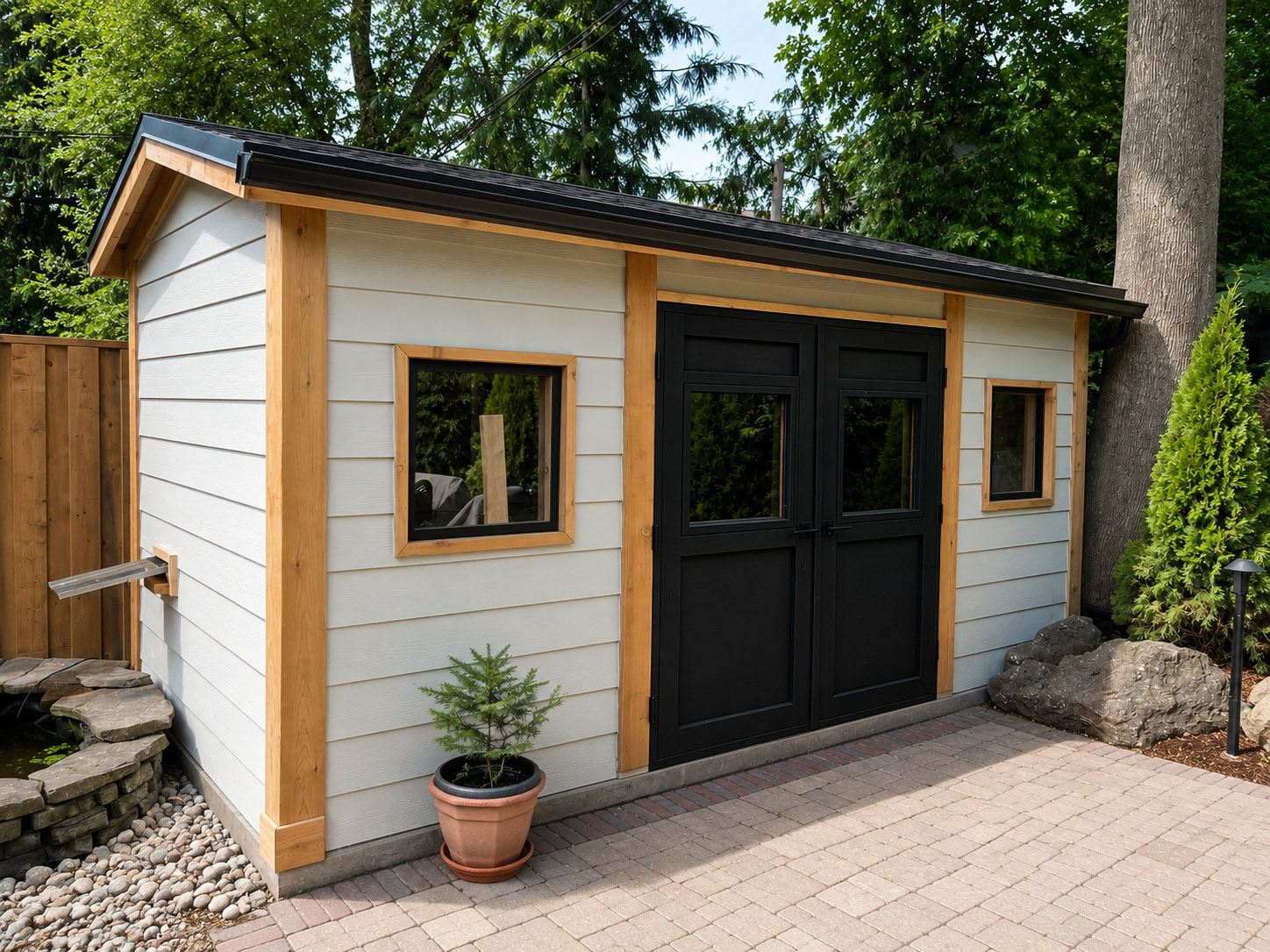 Finished garden workshop with siding, windows, custom doors and cedar trim