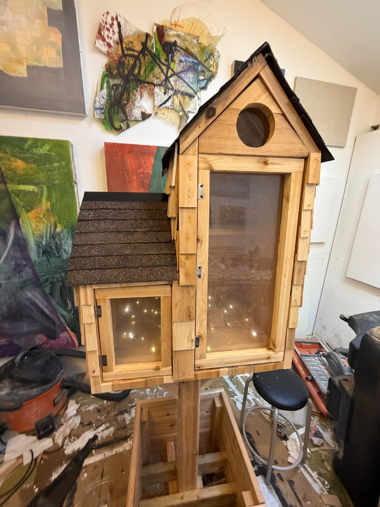 Little Library illuminated with warm lights during workshop testing