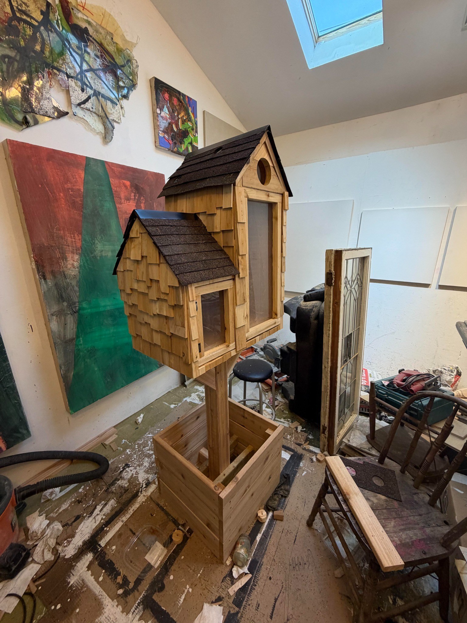 Wider workshop view showing the Little Library, post and planter base under construction